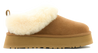 Tan slipper with white fur lining on a white background
