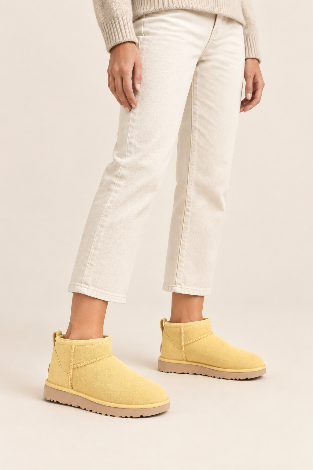 UGG Ultra Mini Muted Mustard boots on a female model